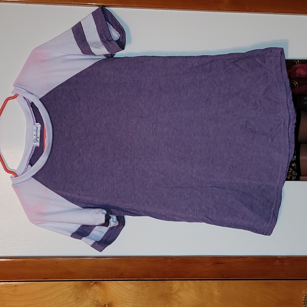 Size L, fits like a M T shirt, purple and white